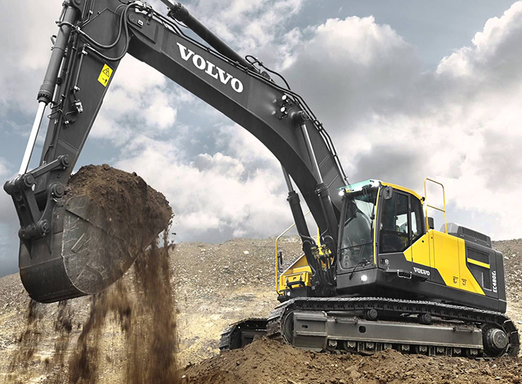 Heavy Equipment. Image of large excavator scooping dirt.